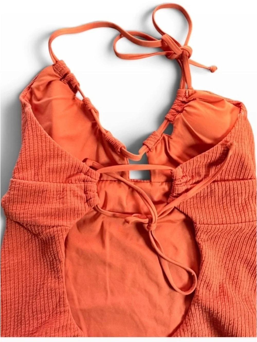 BECCA cut out textured tie back One Piece swimsuit rust orange size M $138 New